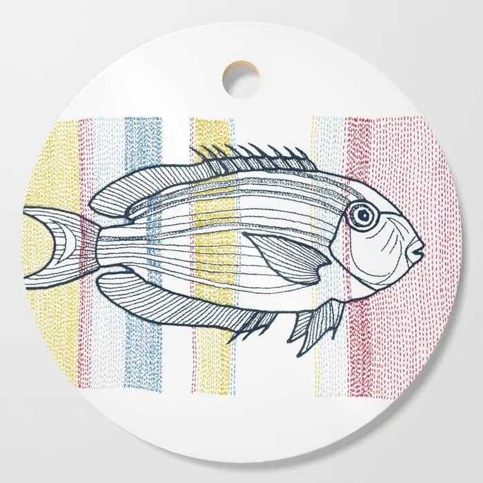 stitches - fish, a VrijFormaat design on a Society6 cutting board